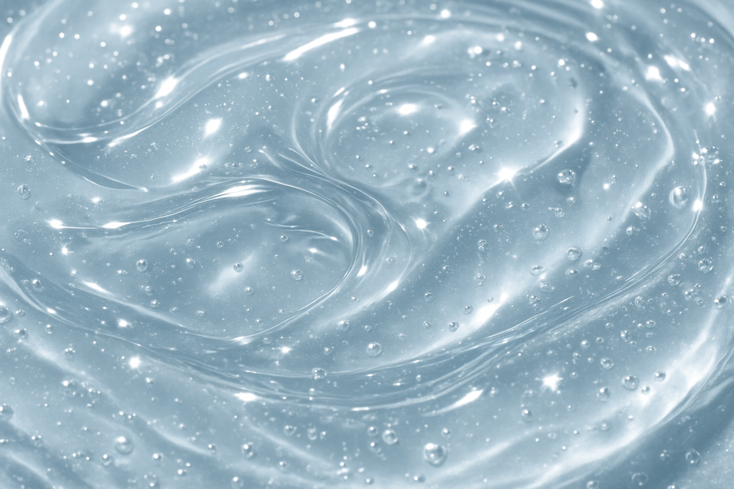 Close-up texture shot of the translucent jelly serum catching light, showing its hydrating consistency.